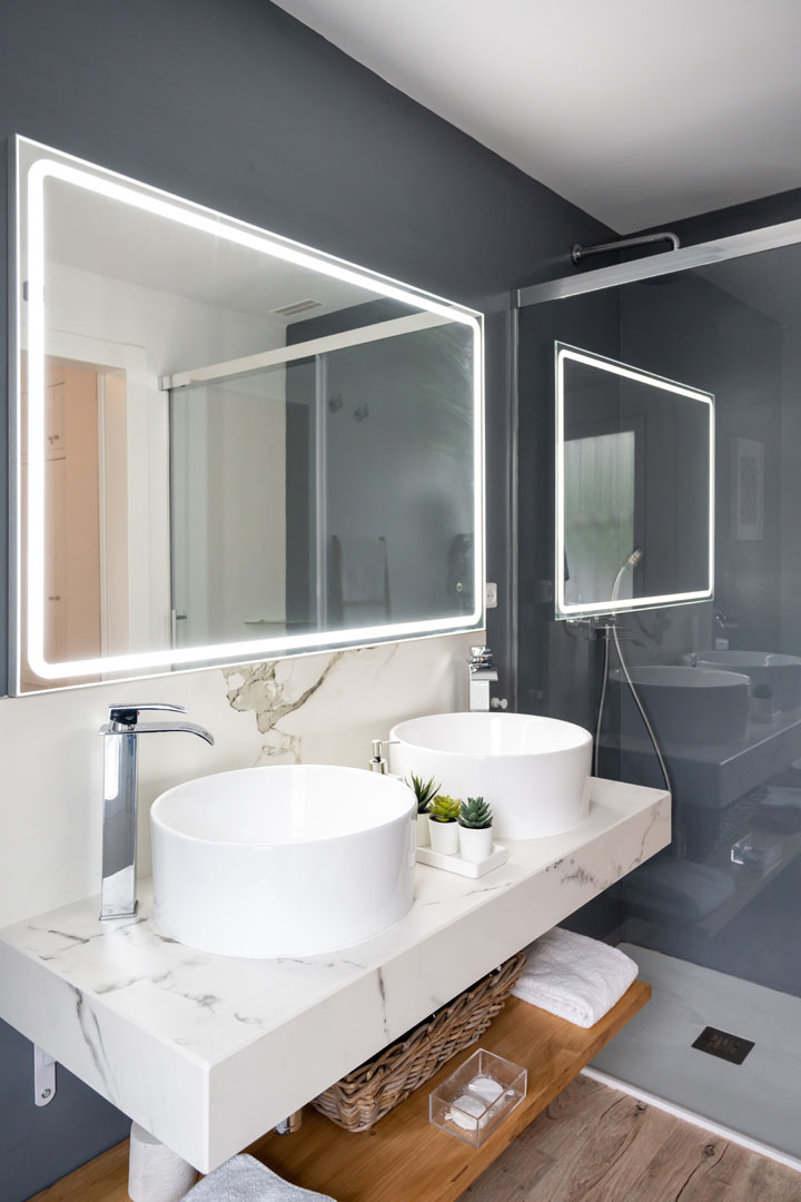 Interior of light modern bathroom with a mirror with light